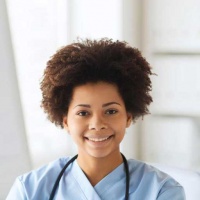 testimonial-happy-female-doctor-or-nurse-writing-to-clipboard testimonial-happy-female-doctor-or-nurse-writing-to-clipboard